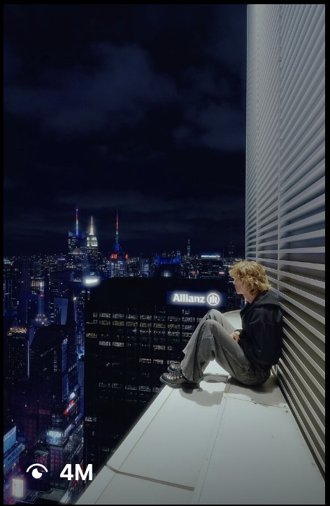 Shane Boyer on a Manhattan skyscraper ledge at night with the New York skyline behind — a 4M-view TikTok